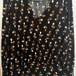 V-neck floral band at the bottom and band around sleeves.